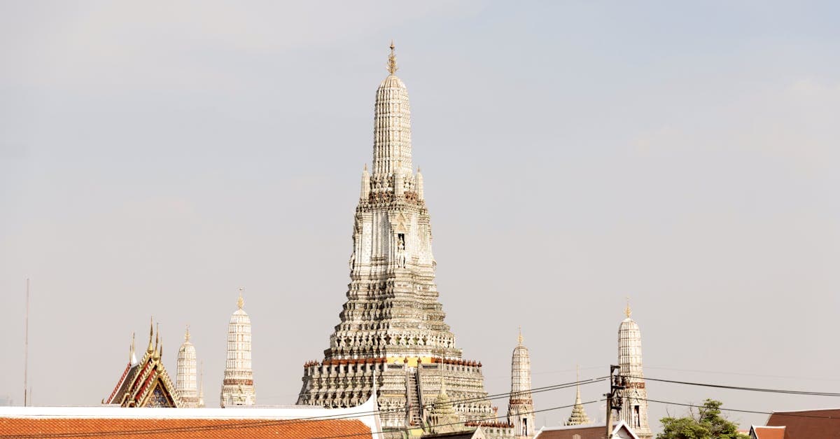 A stunning view of Wat Arun temple in Bangkok, showcasing its intricate architecture under daylight.