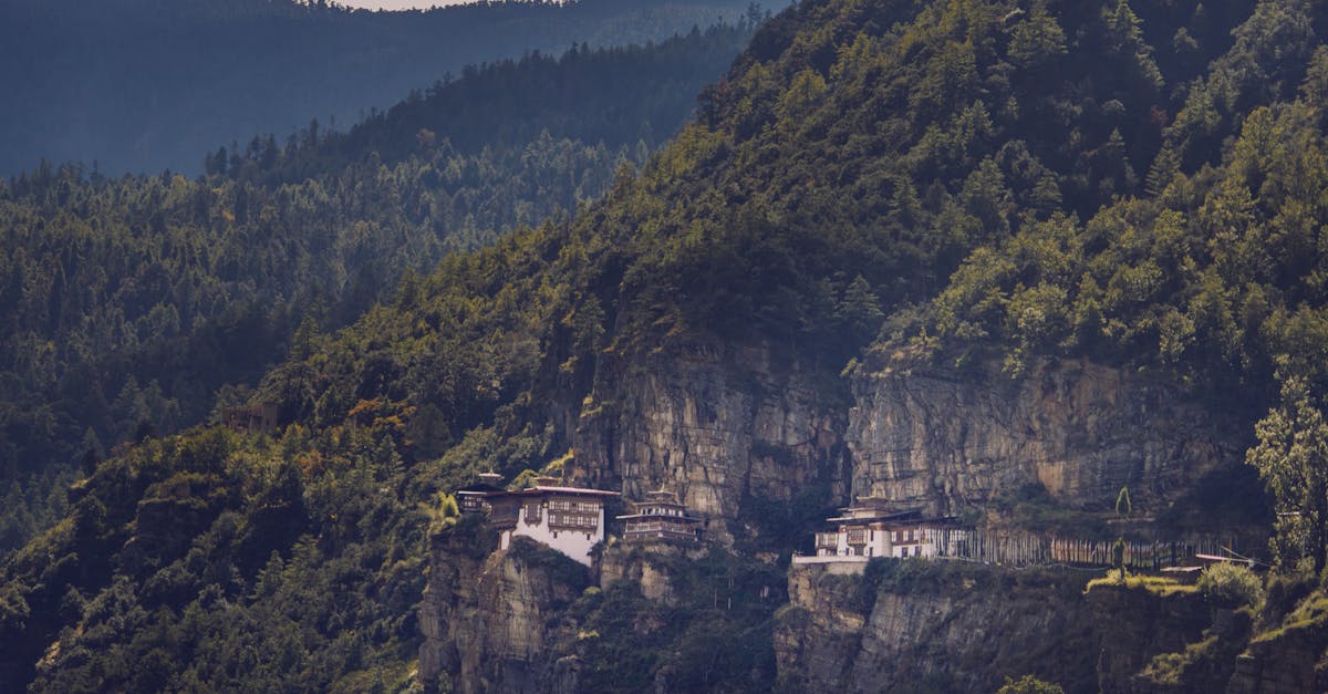 The famous Tiger's Nest Monastery perched on a cliffside in Bhutan's lush mountains.