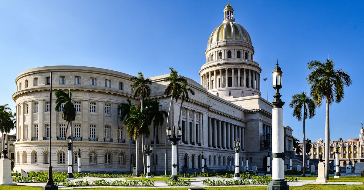 Scenic view of the El Capitolio framed by palm trees in Havana, Cuba.