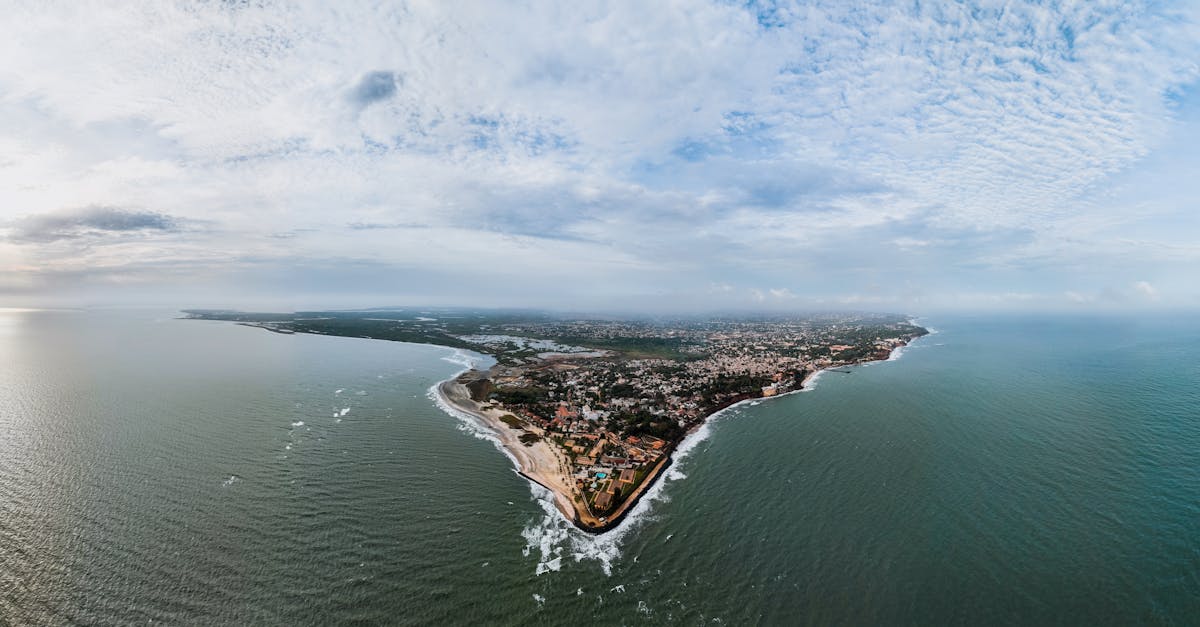 Stunning aerial view of Banjul, The Gambia's scenic coastline under a cloudy sky.