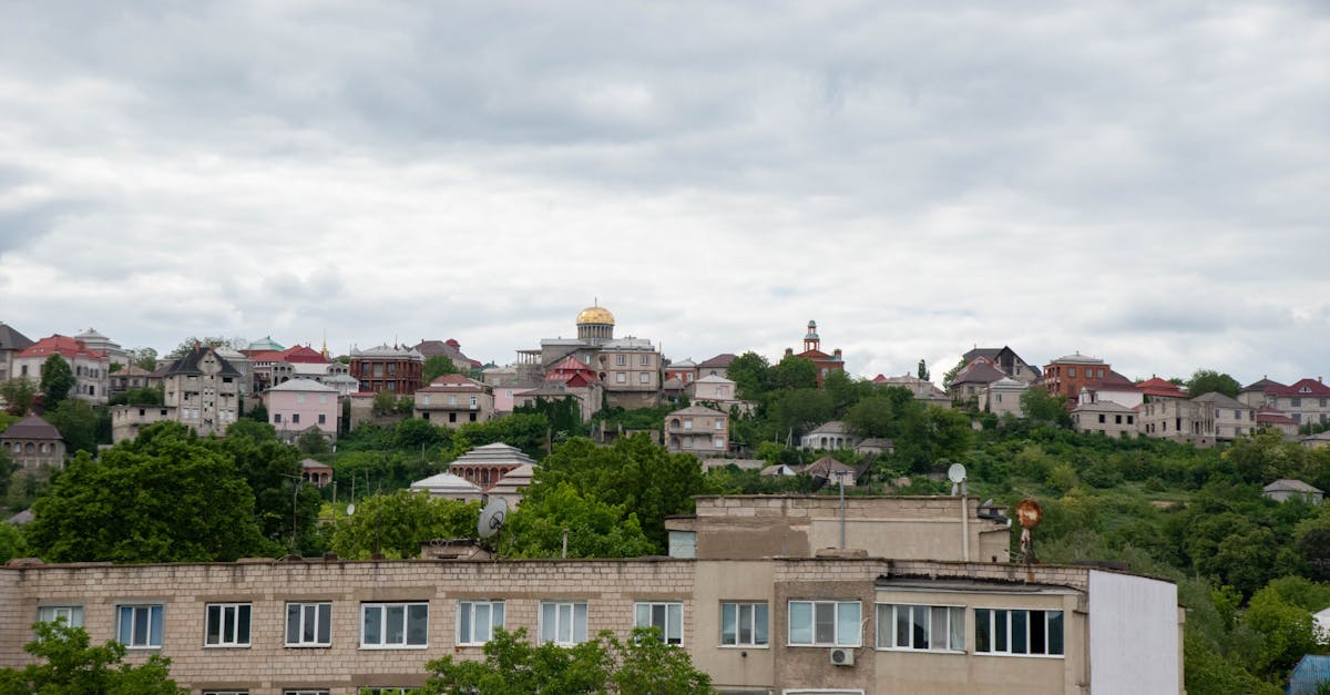 Charming vista of residential buildings in Soroca, Moldova, under a cloudy sky.