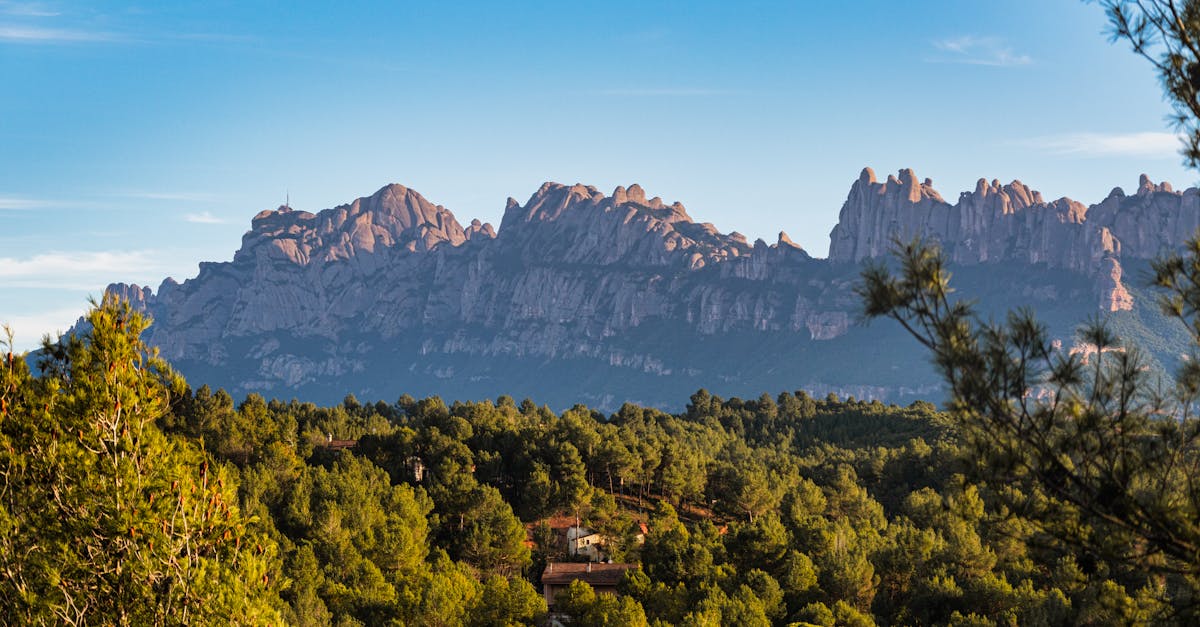 Breathtaking view of Montserrat mountain with lush green forest in Monistrol de Montserrat, Spain.