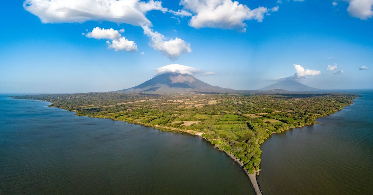 Explore the stunning aerial view of Ometepe Island and its volcanic landscape surrounded by serene waters.