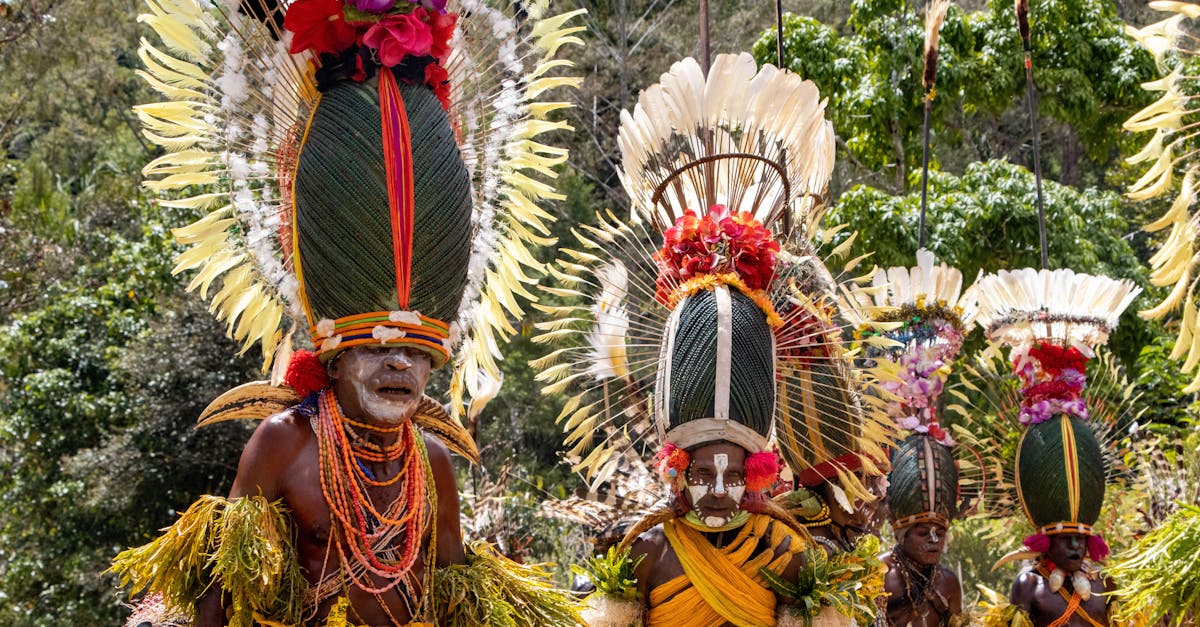 Colorful tribal dancers in traditional attire at a cultural festival in Papua New Guinea.