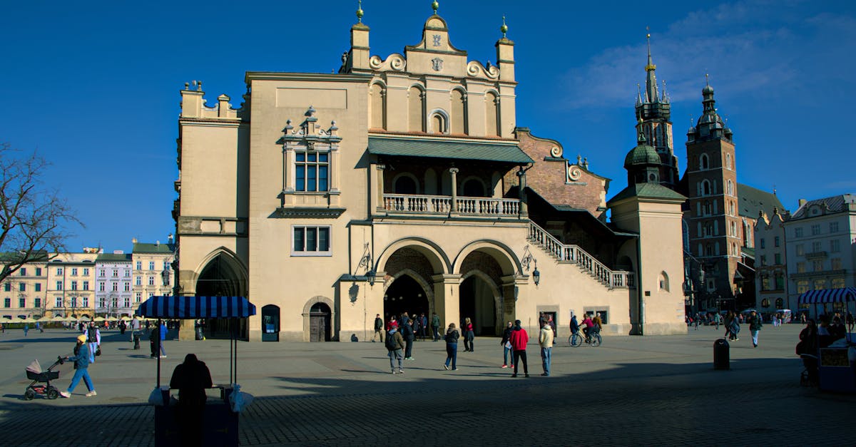 Explore the historic and vibrant architecture of Kraków's Market Square, a cultural hub.