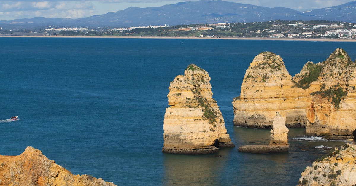 Stunning view of Praia Dona Ana's cliffs in Lagos, Portugal overlooking the Atlantic Ocean.