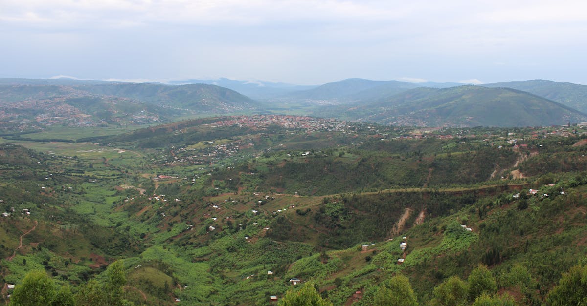 Breathtaking aerial view of Kigali's picturesque green hills and valleys, showcasing stunning Rwandan landscapes.