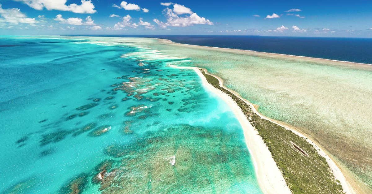 Stunning aerial shot capturing the vibrant turquoise waters and beautiful sandbars around Mauritius.