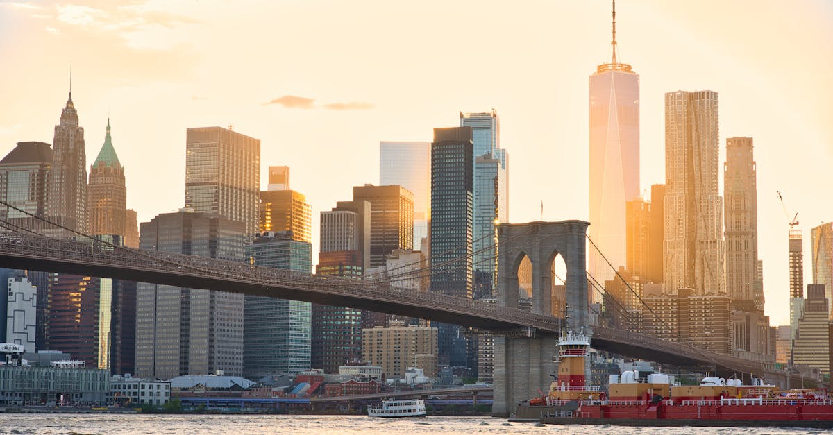 A stunning view of the Brooklyn Bridge and New York City's skyline at sunset.