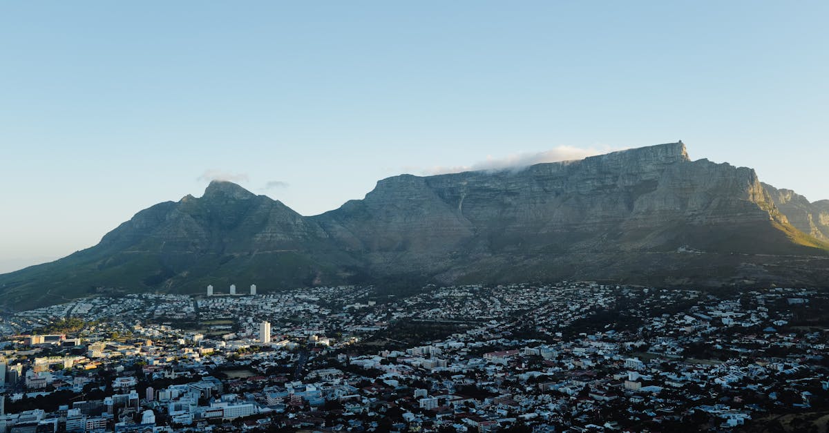 Stunning aerial view of Cape Town cityscape with Table Mountain in the background at daytime.